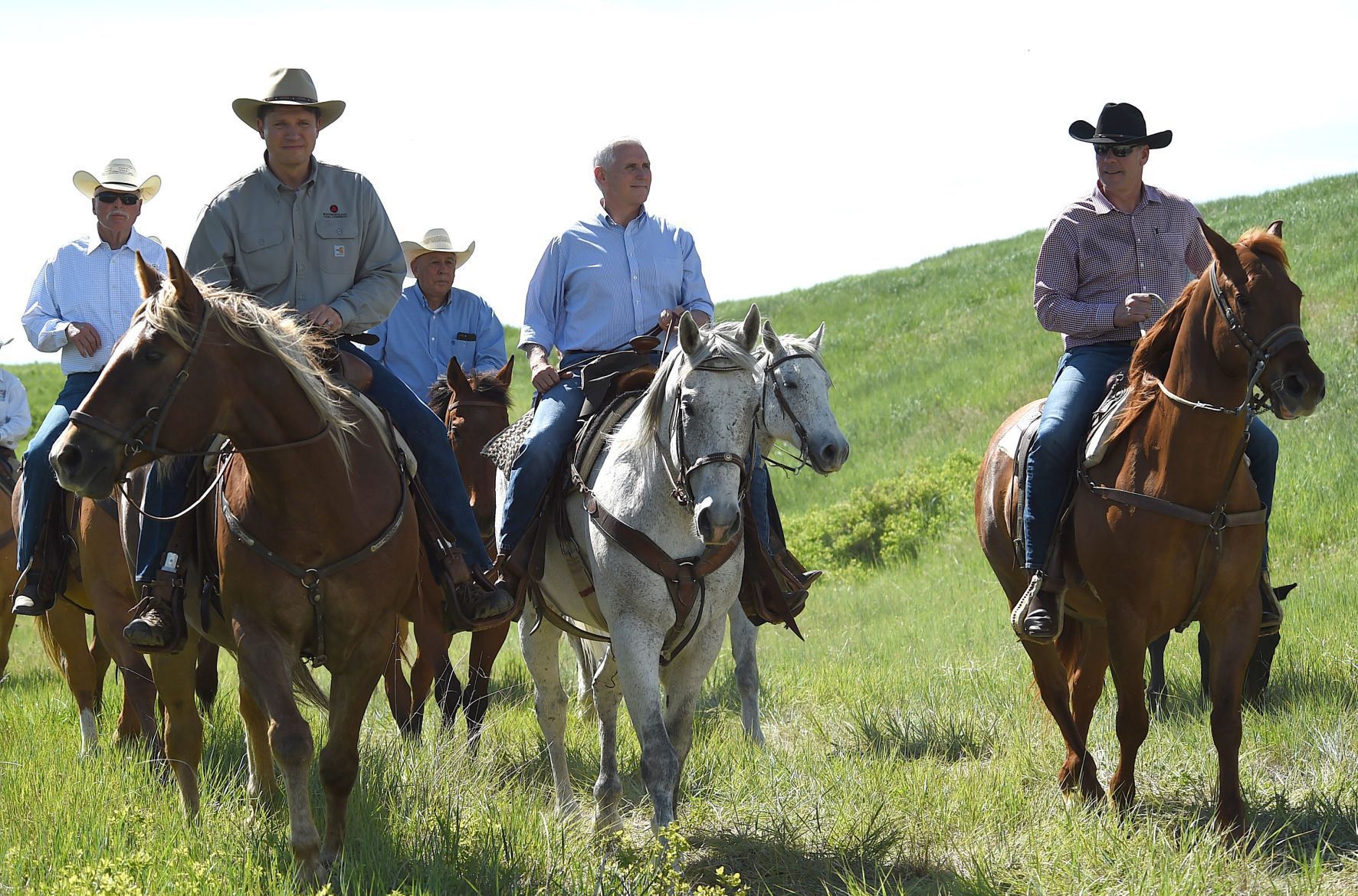 Pence Zinke and miners on horseback